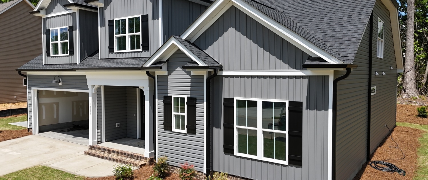 Exterior view of a house in the Fern Valley neighborhood, Fuquay-Varina, NC, inspected by Realm Inspections for safety and quality.